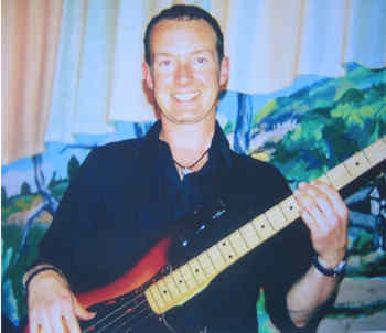 listen to bass playing with Andy Williams bassist with the big blue blues band