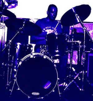 Ben Matthews plays drums with The Big Blue